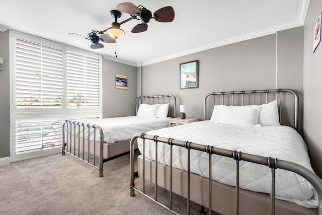 bedroom with ornamental molding, light carpet, and ceiling fan