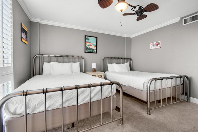 bedroom with ceiling fan, light carpet, and crown molding