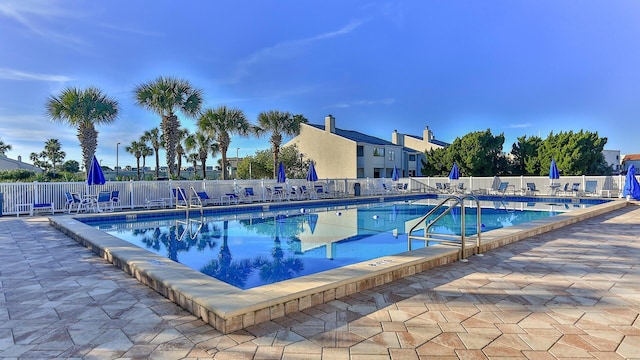 view of swimming pool with a patio