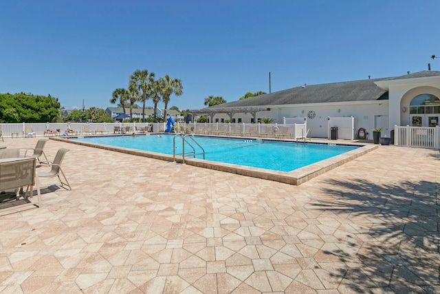 view of swimming pool with a patio