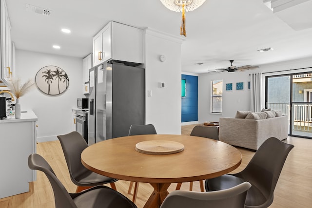 dining room featuring light hardwood / wood-style flooring and ceiling fan