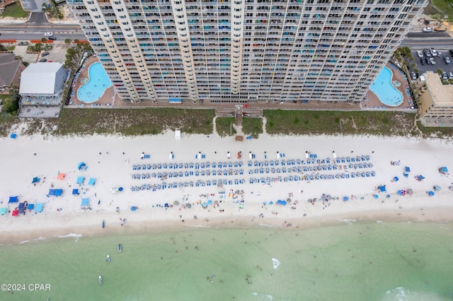 birds eye view of property featuring a water view and a view of the beach