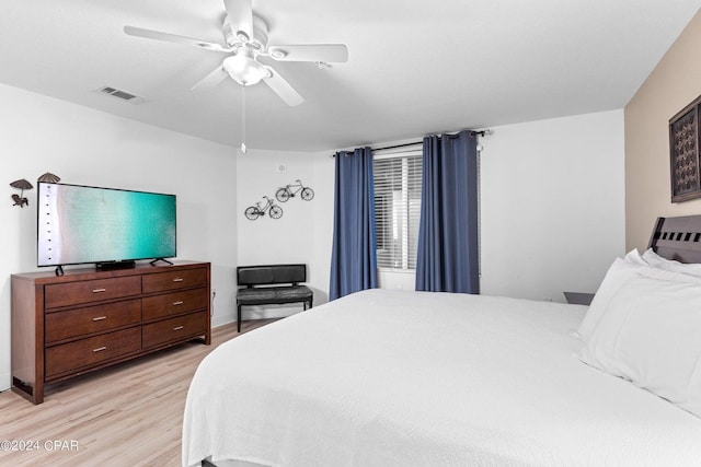 bedroom featuring ceiling fan and light hardwood / wood-style floors