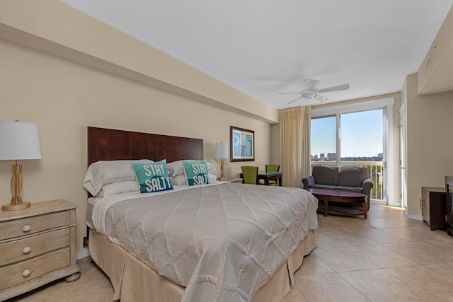 tiled bedroom with ceiling fan and access to exterior