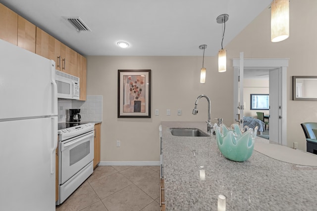 kitchen featuring decorative light fixtures, white appliances, light tile flooring, sink, and tasteful backsplash