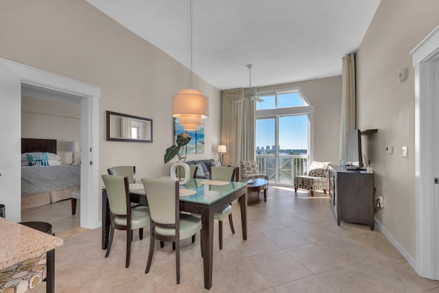 tiled dining space featuring ceiling fan