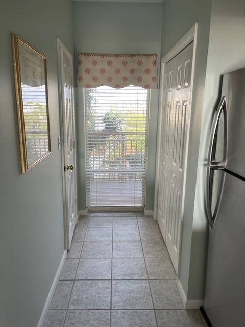 doorway featuring light tile floors