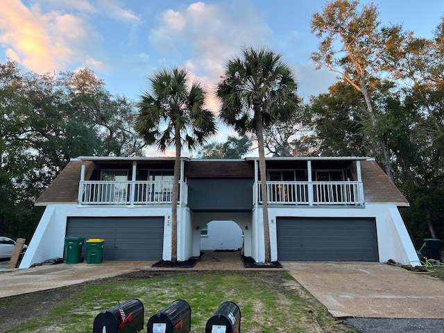 106 Star Dr Unit A, B, C, Fort Walton Beach, FL 32547 - view of front facade featuring a balcony, a lawn, and a garage