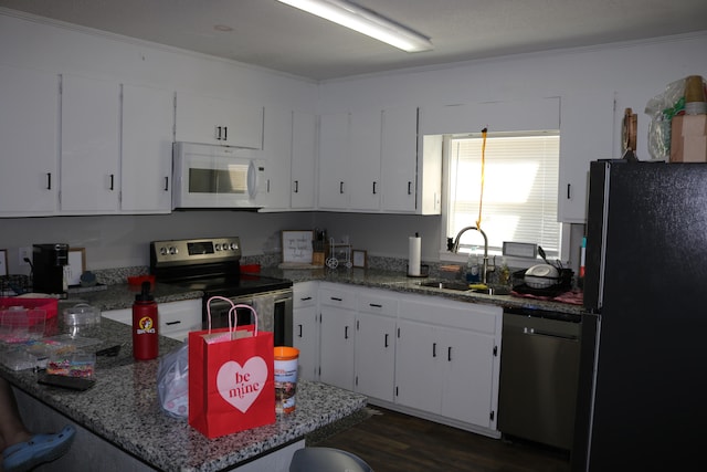 106 Star Dr Unit A, B, C, Fort Walton Beach, FL 32547 - kitchen with white cabinets, sink, stainless steel appliances, and light stone countertops