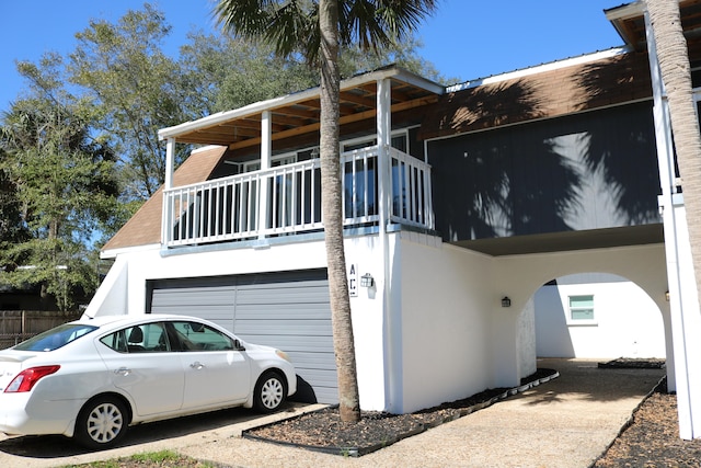 106 Star Dr Unit A, B, C, Fort Walton Beach, FL 32547 - view of side of property with a garage and a balcony
