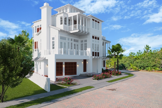 view of front of home featuring a balcony