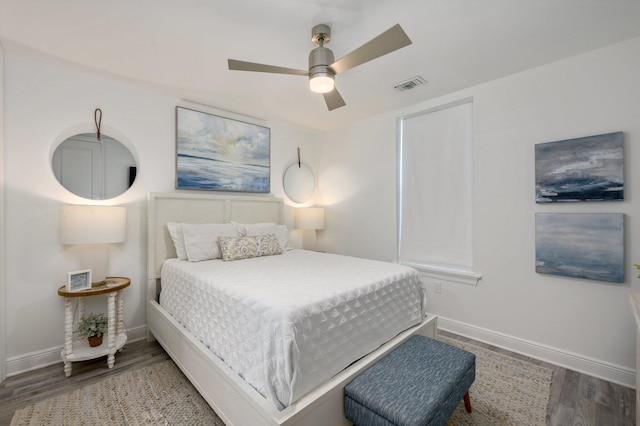 bedroom featuring dark hardwood / wood-style flooring and ceiling fan