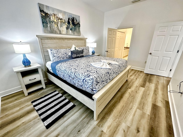 bedroom with light hardwood / wood-style floors