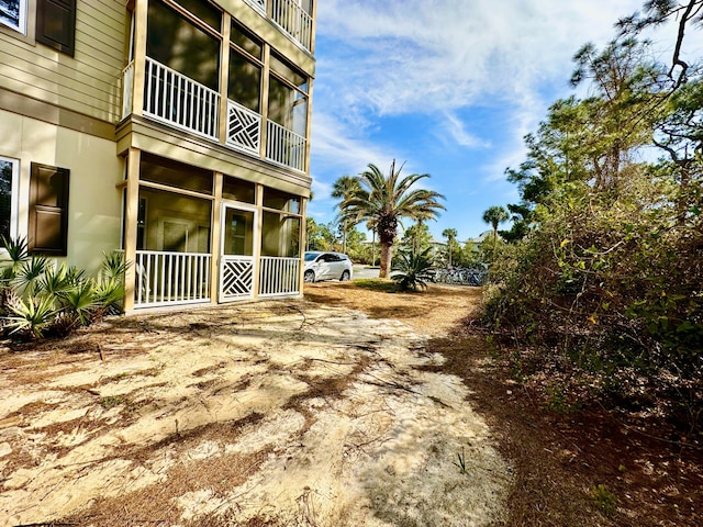 view of yard featuring a balcony