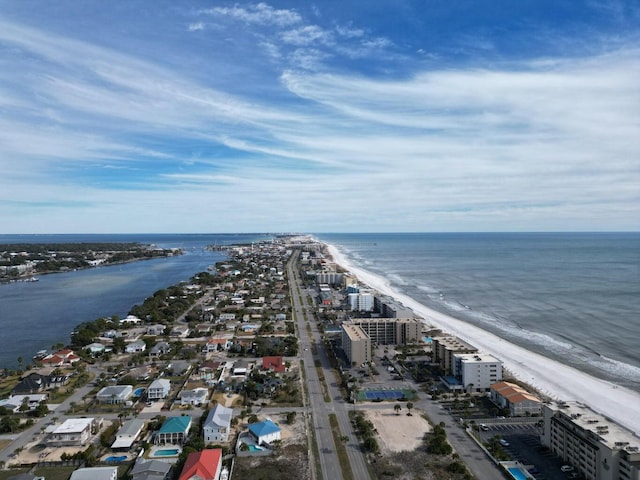 drone / aerial view featuring a water view and a beach view