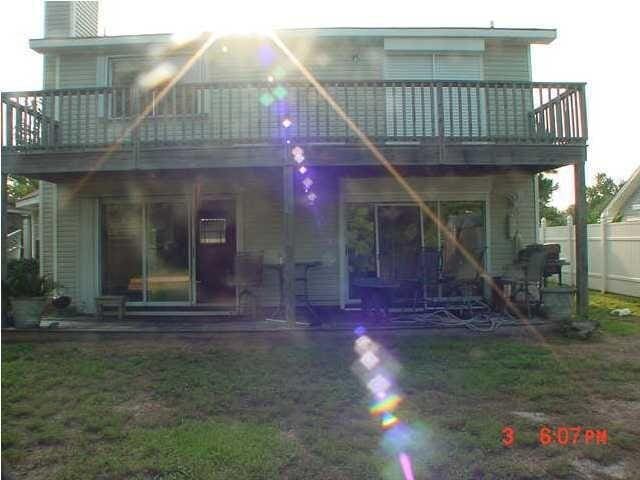 rear view of property with a balcony