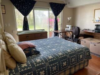 bedroom featuring wood-type flooring