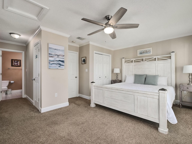 carpeted bedroom featuring ornamental molding, ceiling fan, and a textured ceiling