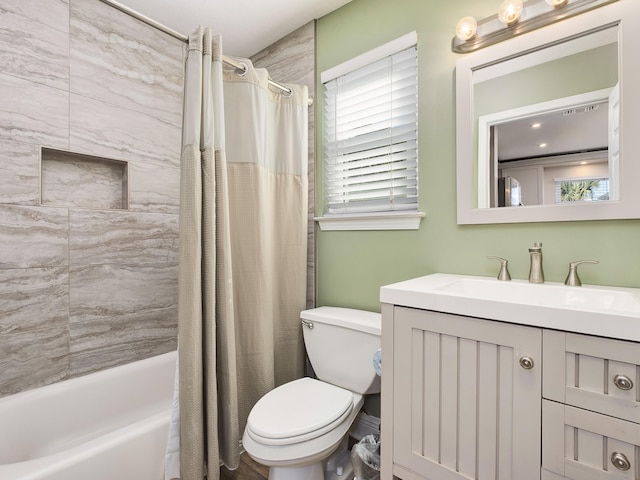 full bathroom featuring vanity, shower / bath combination with curtain, and toilet