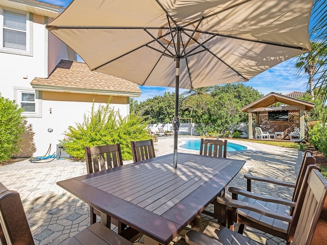 view of terrace with a gazebo and a fenced in pool