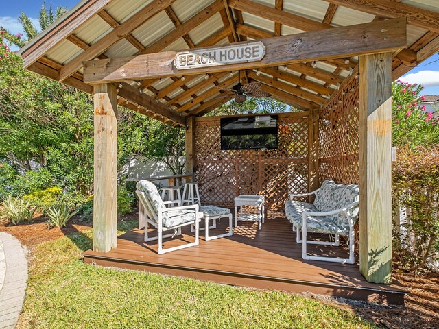 deck featuring ceiling fan and a gazebo