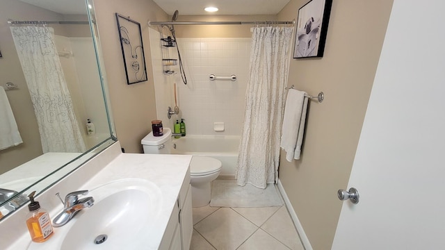 bathroom featuring baseboards, toilet, tile patterned floors, shower / bath combination with curtain, and vanity