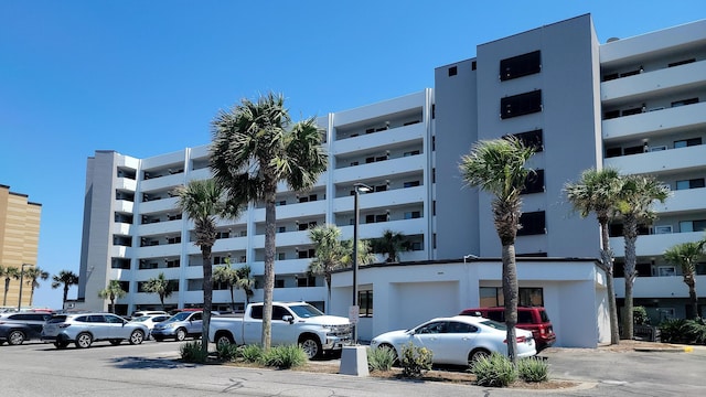 view of property with uncovered parking