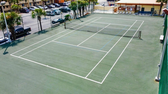 view of sport court with fence