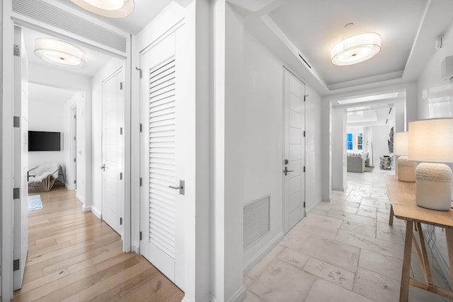 hallway featuring light tile floors