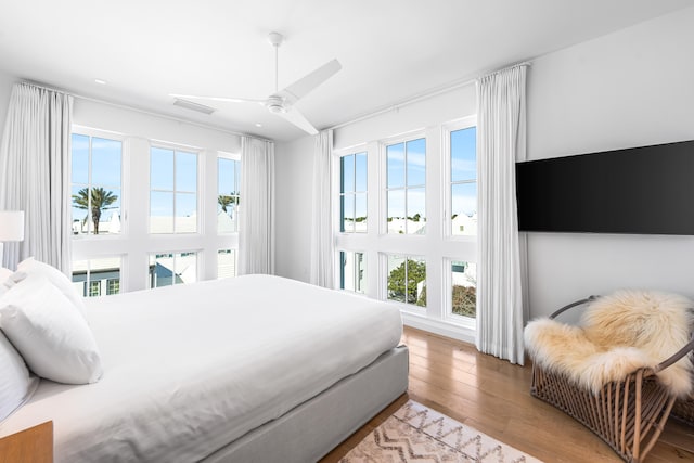 bedroom featuring light hardwood / wood-style flooring and ceiling fan