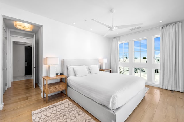 bedroom featuring light hardwood / wood-style flooring and ceiling fan