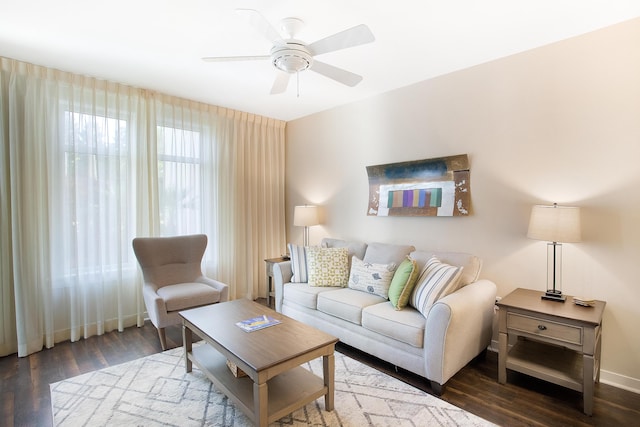 living room featuring dark hardwood / wood-style flooring and ceiling fan