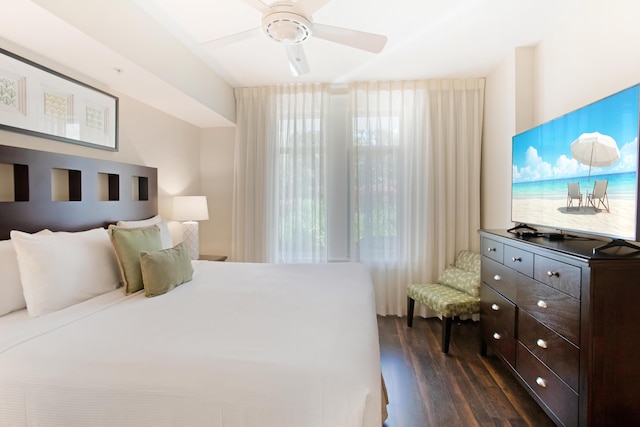 bedroom featuring ceiling fan and dark hardwood / wood-style floors