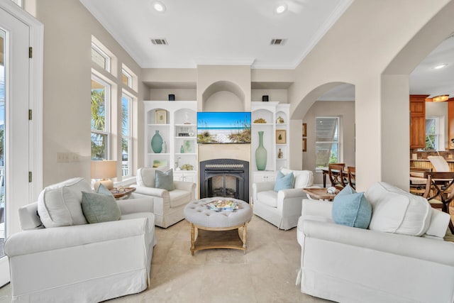 living room featuring light tile patterned floors and ornamental molding