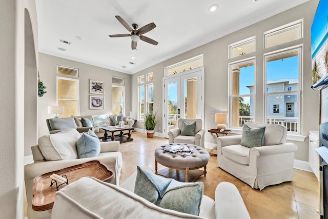 living room featuring french doors, ceiling fan, crown molding, and light tile patterned flooring