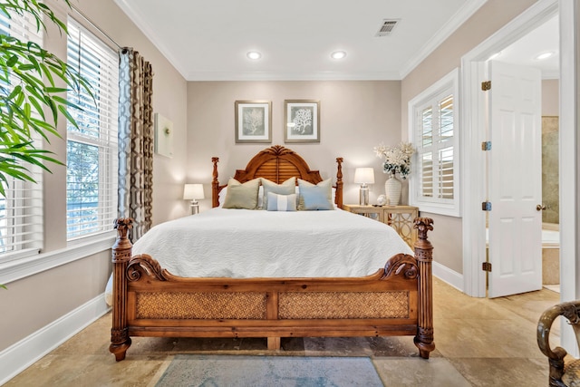 bedroom with connected bathroom and crown molding