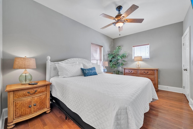 bedroom with wood-type flooring and ceiling fan