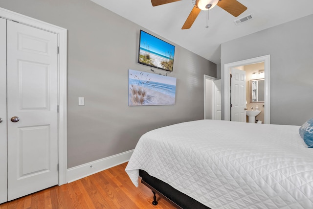 bedroom with ceiling fan, sink, ensuite bathroom, and wood-type flooring