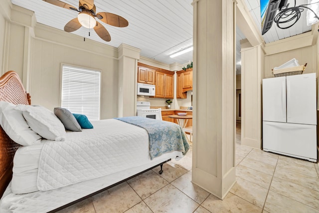 tiled bedroom featuring wooden walls, white fridge, ceiling fan, and crown molding