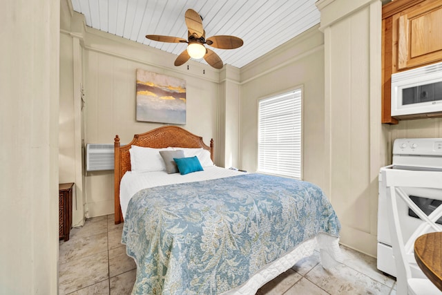 tiled bedroom featuring a wall unit AC, ceiling fan, and ornamental molding