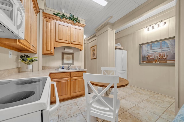 kitchen with light brown cabinets, white appliances, crown molding, sink, and wood ceiling