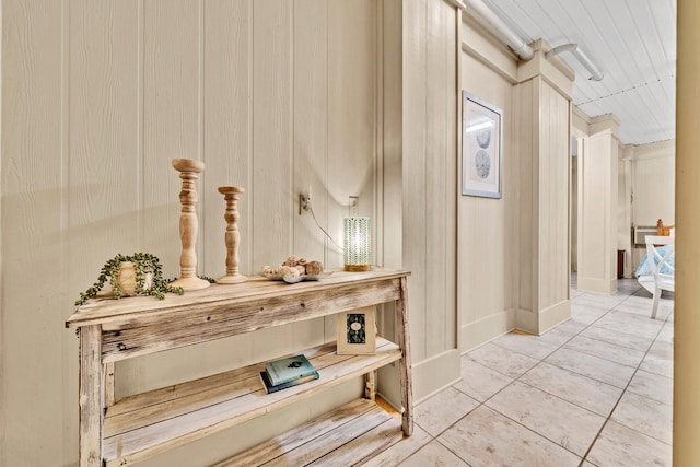 hallway with tile patterned flooring