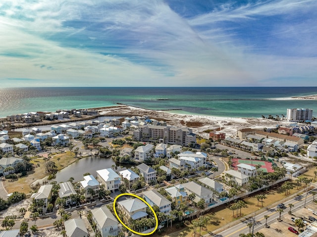 bird's eye view with a beach view and a water view