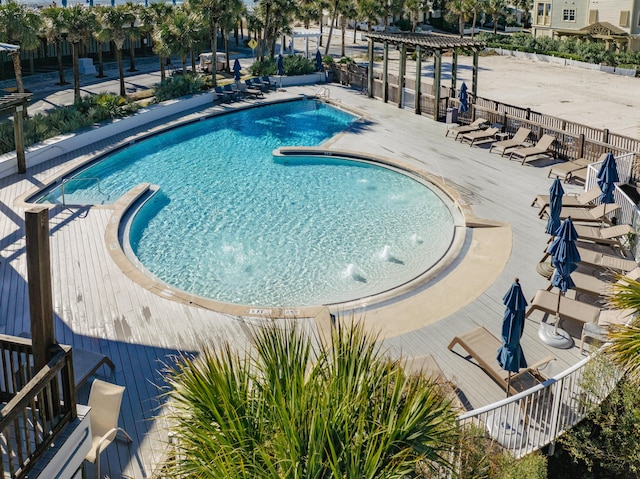 view of pool with pool water feature and a patio area