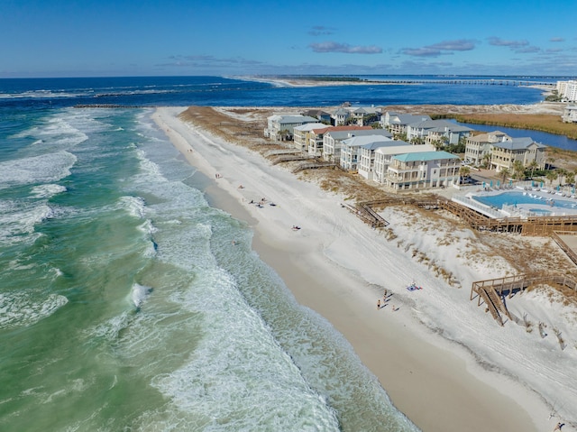 aerial view featuring a water view and a beach view