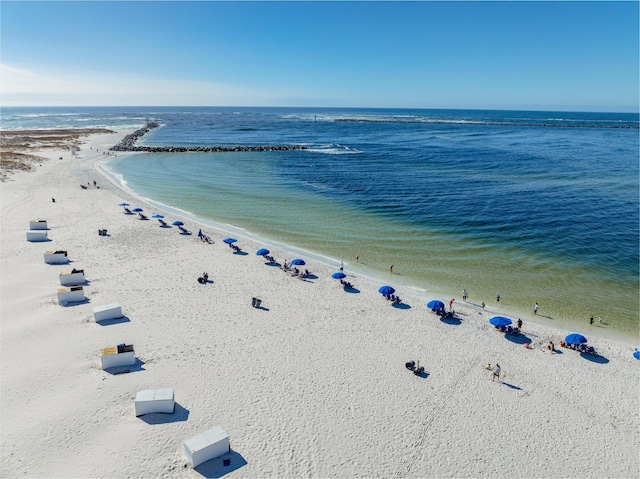 drone / aerial view featuring a view of the beach and a water view