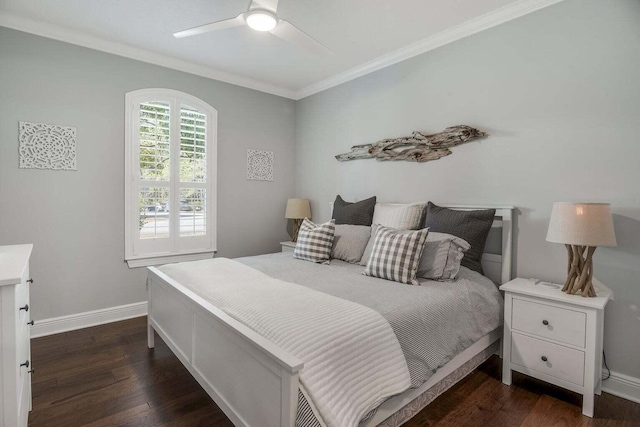 bedroom with ornamental molding, ceiling fan, and dark wood-type flooring