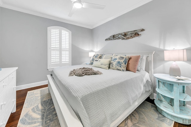 bedroom with ornamental molding, ceiling fan, and dark hardwood / wood-style floors