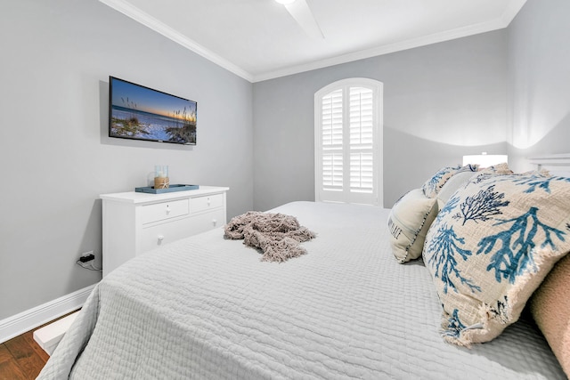 bedroom with ceiling fan, crown molding, and light hardwood / wood-style flooring