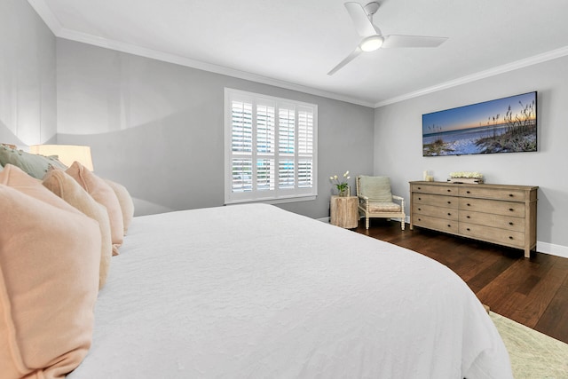 bedroom featuring ornamental molding, dark hardwood / wood-style flooring, and ceiling fan